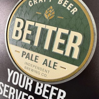 A photo of a beer tap decal with the words BETTER PALE ALE